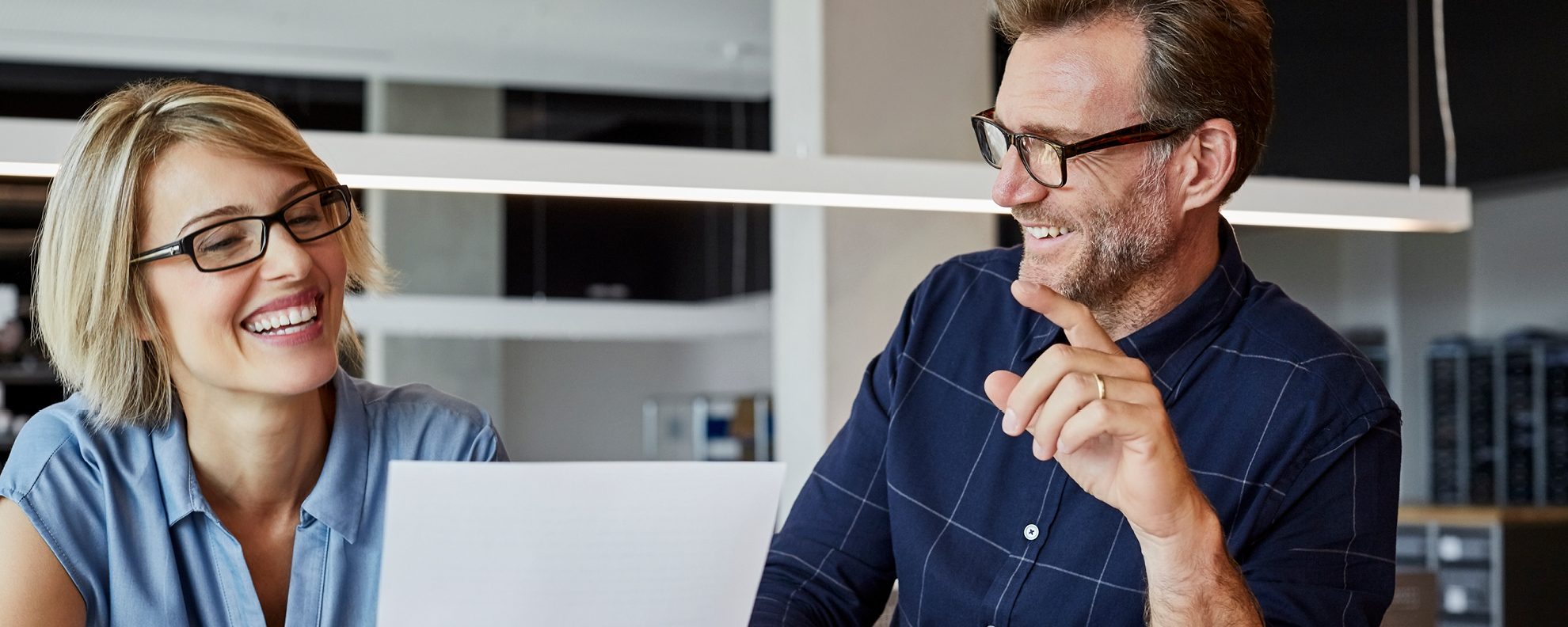 Man and woman looking at paper